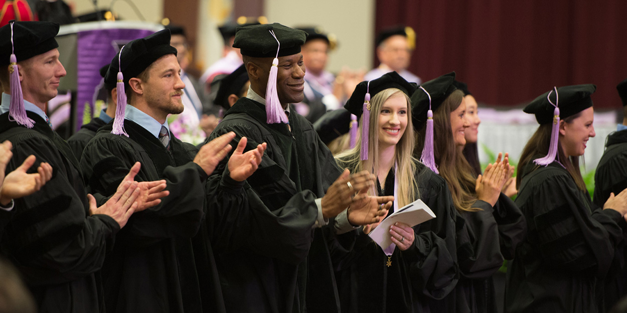 Dental Medicine students celebrate at graduation.